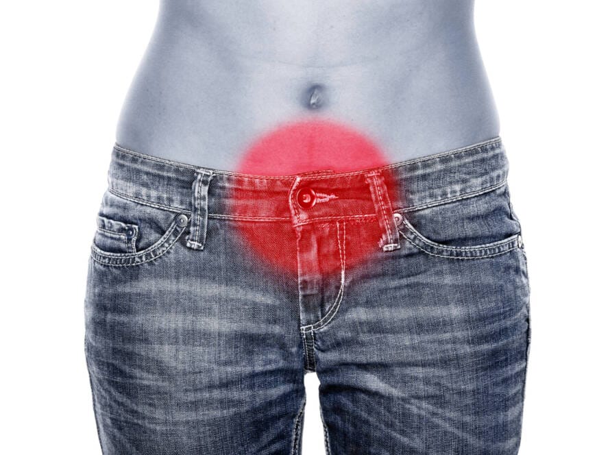 Frau mit Bauchschmerzen, rote Markierung auf der schmerzenden Stelle im Unterbauch. Hormonstörungen. DP @ Maridav